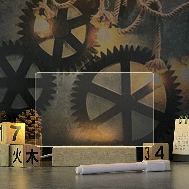 Horizontal acrylic LED message board on its illuminated base with writing pen